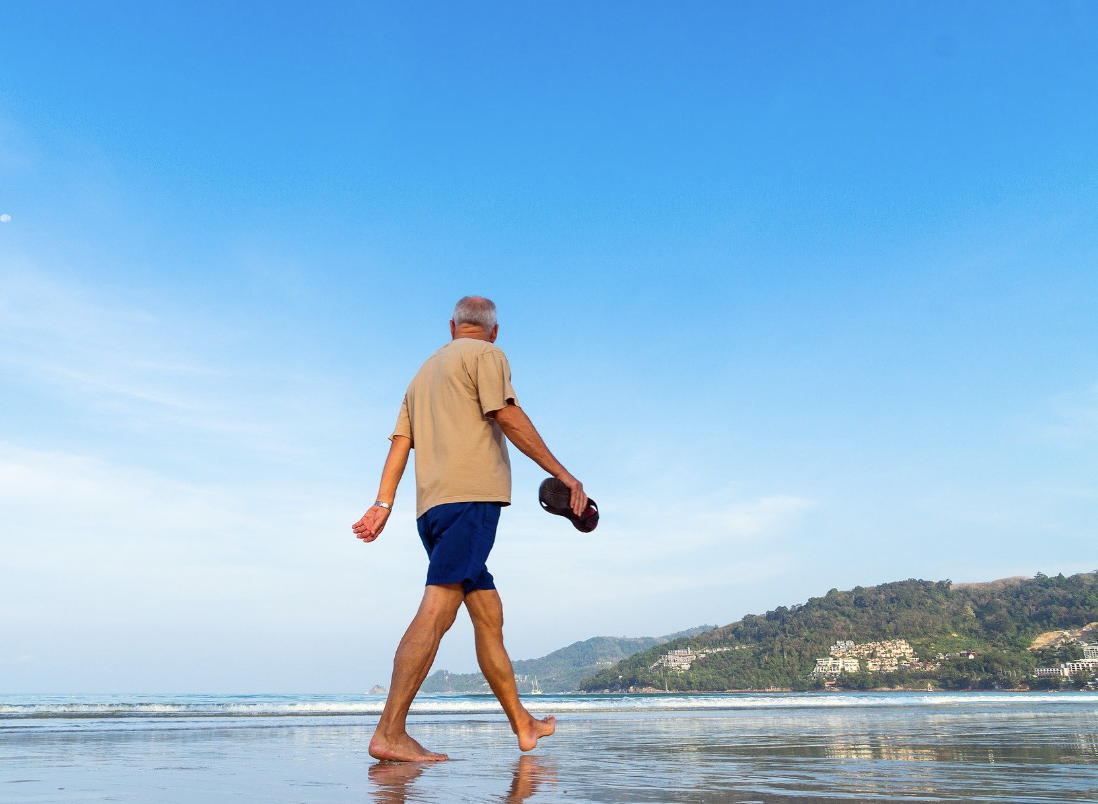 a man walking on the beach